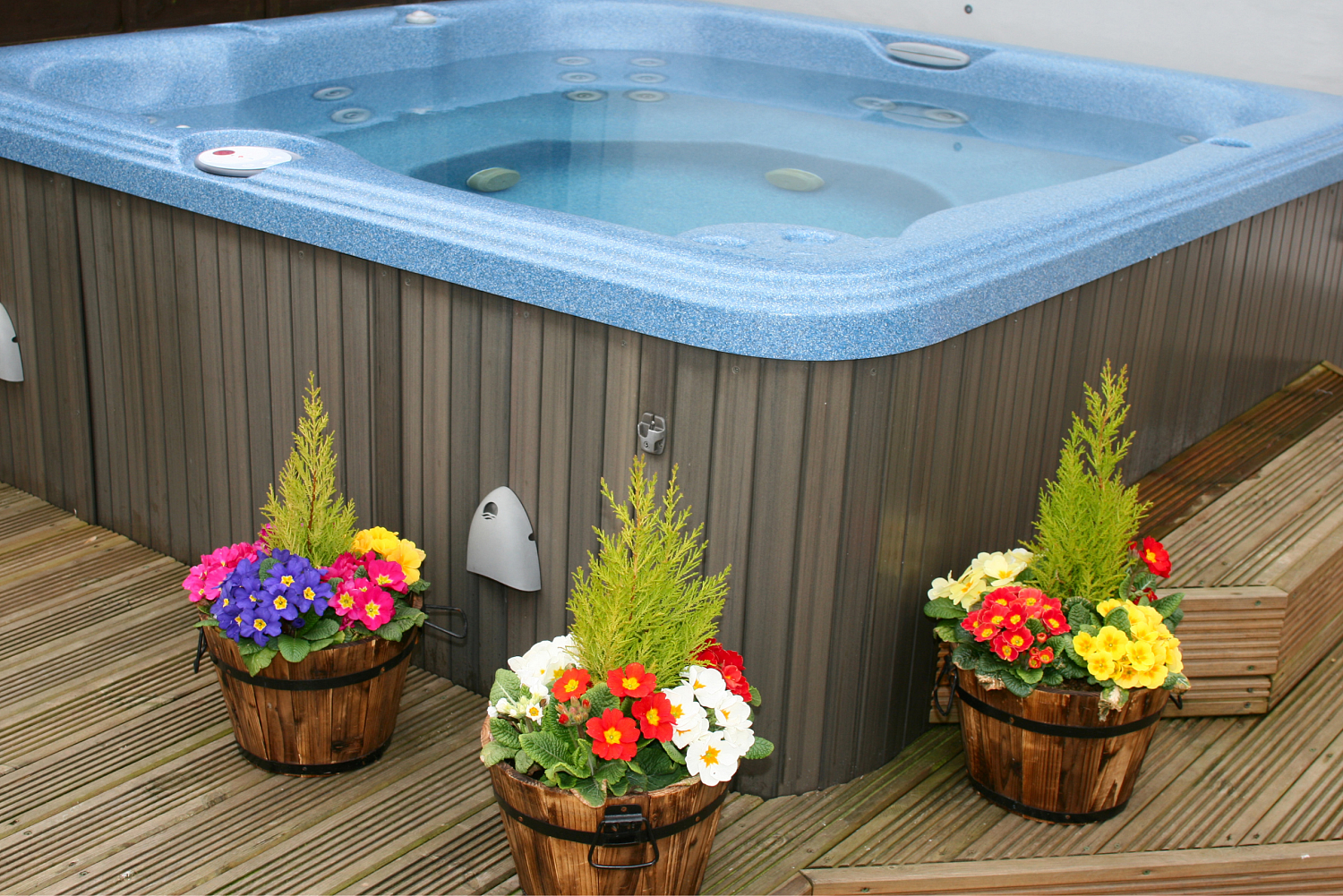 hot tub with landscaping
